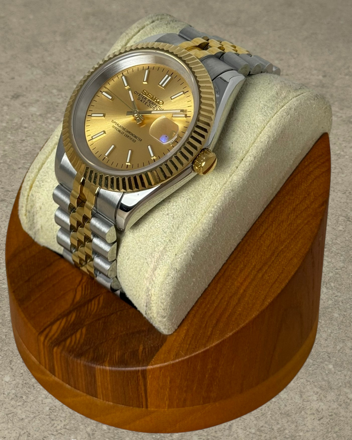 PB TimePiece Classic Date watch with a champagne dial, fluted bezel, and two-tone gold and steel jubilee bracelet.