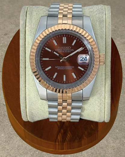 PB TimePiece Classic Date watch with a chocolate dial, rose gold fluted bezel, and two-tone jubilee bracelet.