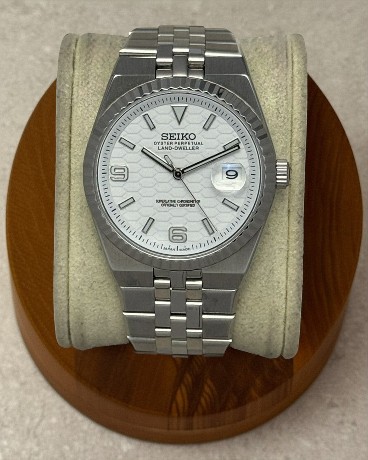 PB TimePiece Honeycomb watch with white textured dial, stainless steel jubilee bracelet, and fluted bezel.
