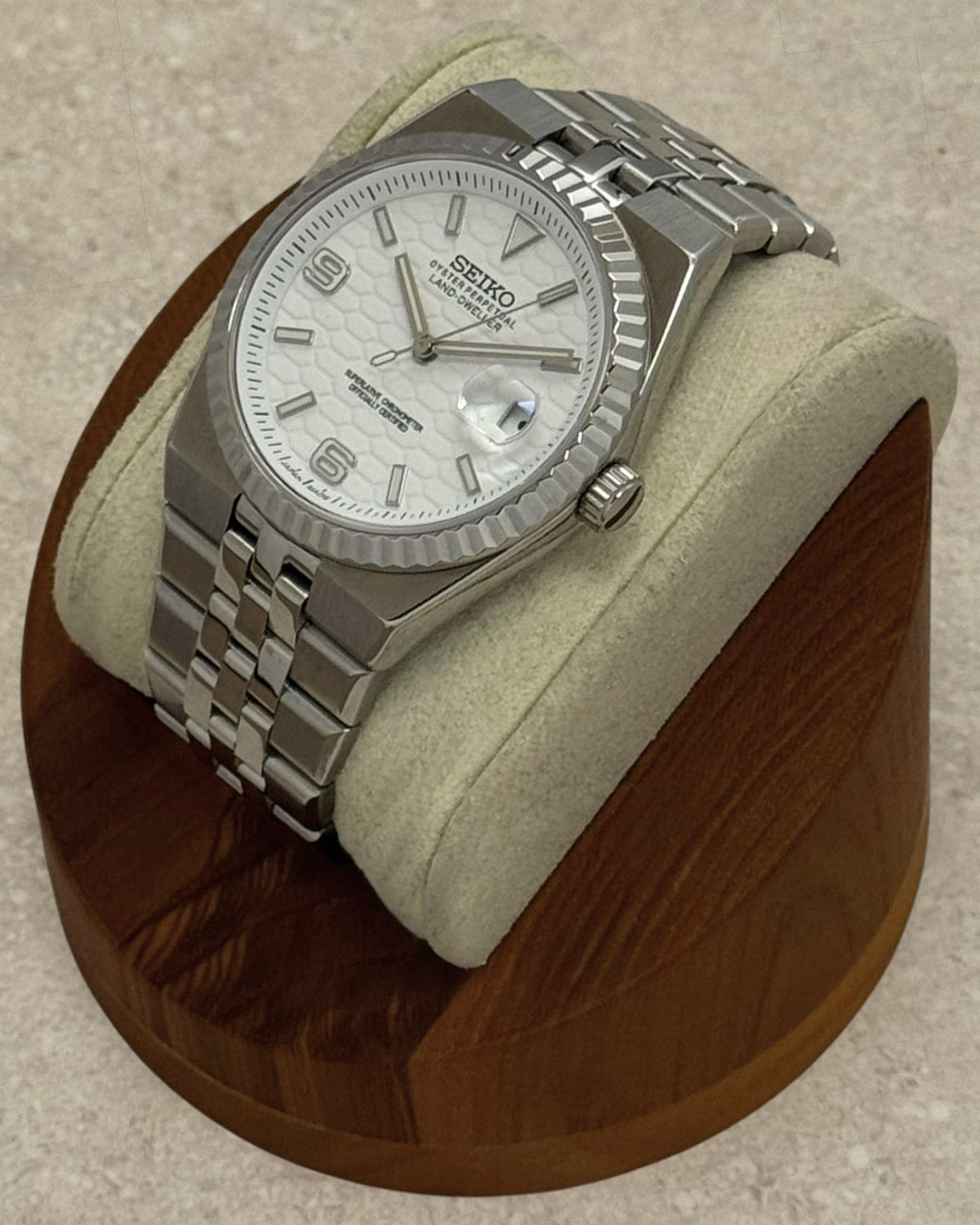 PB TimePiece Honeycomb watch with white textured dial, stainless steel jubilee bracelet, and fluted bezel.