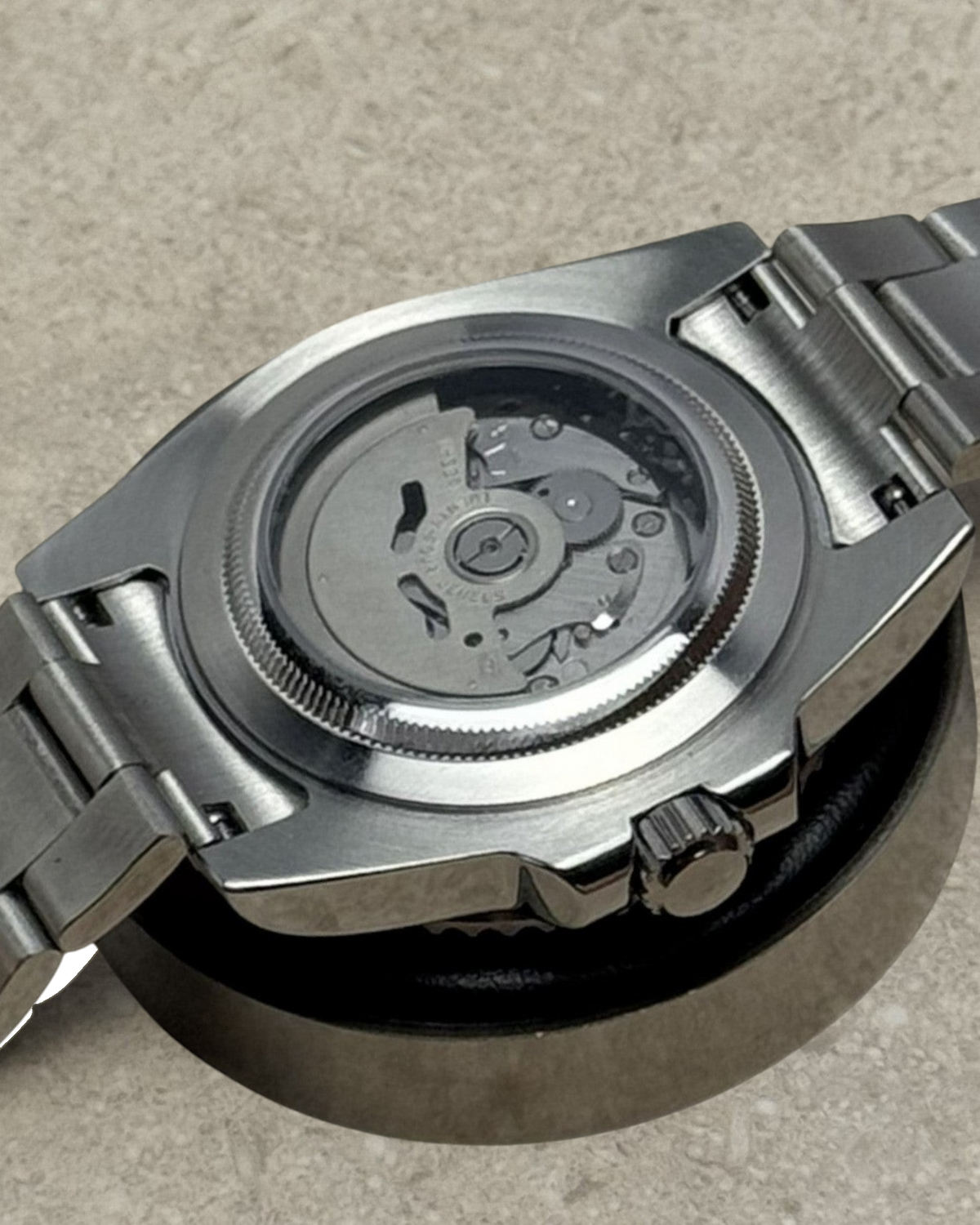PB TimePiece Yachtmaster watch showing the stainless steel case back and automatic movement through sapphire crystal