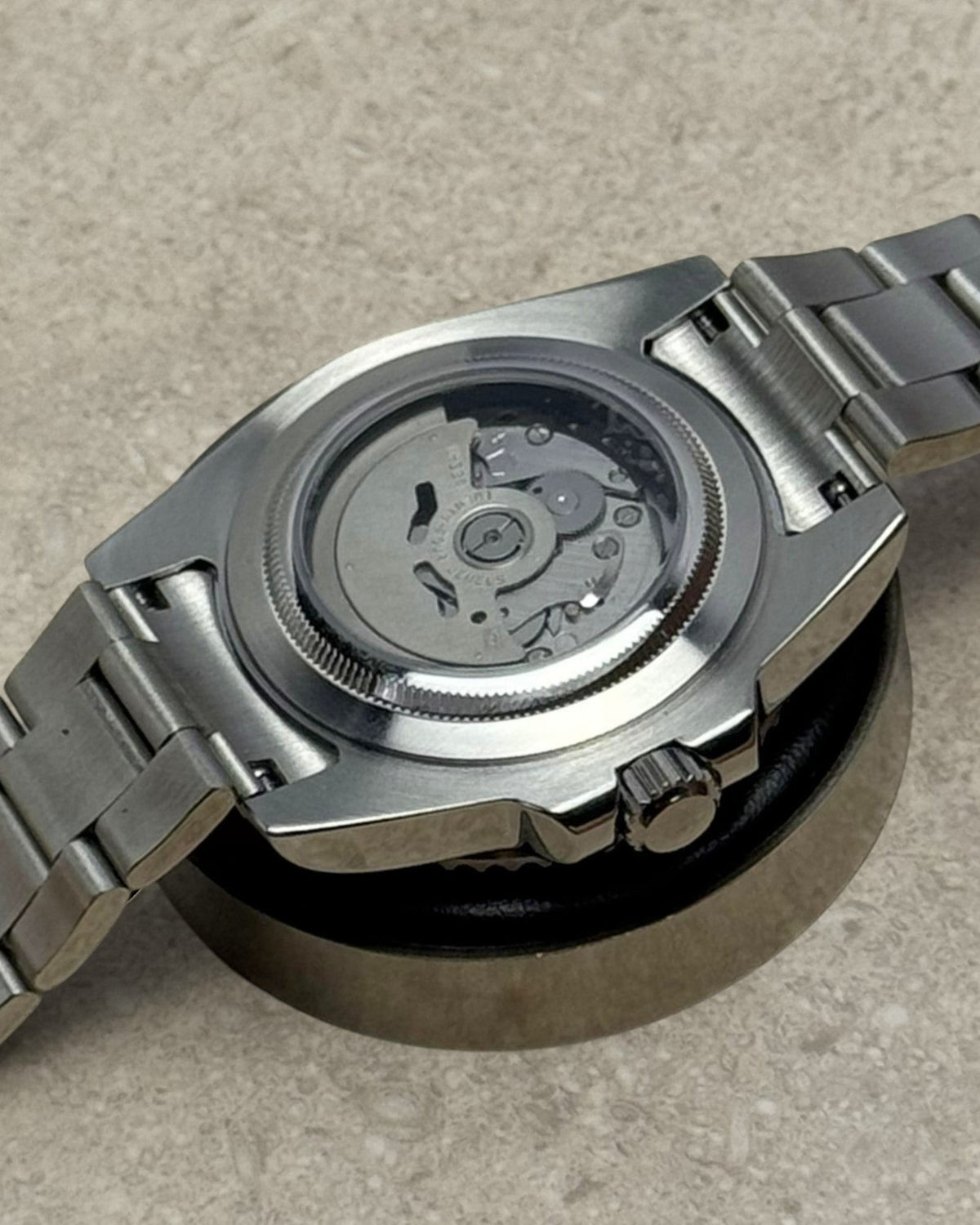 PB TimePiece Yachtmaster watch showing the stainless steel case back and automatic movement through sapphire crystal