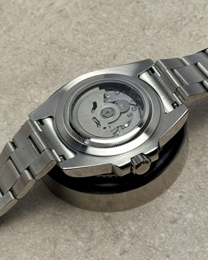 PB TimePiece Yachtmaster watch showing the stainless steel case back and automatic movement through sapphire glass