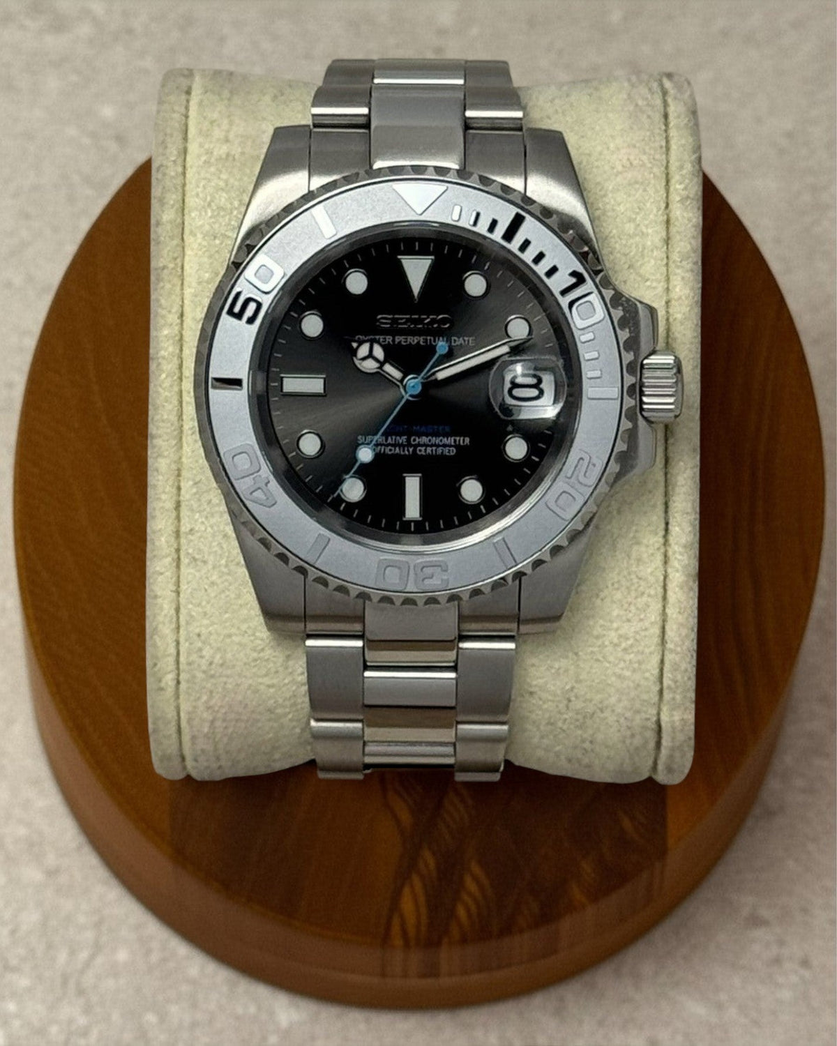 PB TimePiece Yachtmaster watch with gray dial, matte gray bezel, stainless steel case, and baby blue second hand.