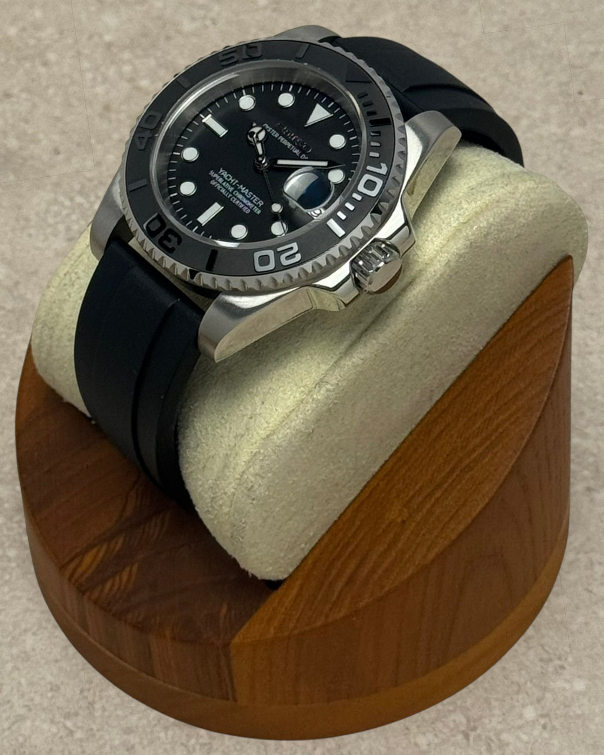 PB TimePiece Yachtmaster watch with a matte black dial, stainless steel 40mm case, and black rubber strap on a stand.